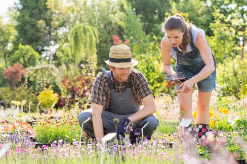 Landscape gardener preparing tools on site exterior